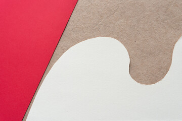 Wall Mural - plain red paper and roughly cut paper with elegant curve on plain brown paper