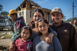 Happy Mexican, Latino, Indian family in front of their house, home, real estate. Homeowners, renters, mom, dad, kids, children, blended families, diverse families, standing in front of their property