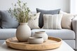 © sorin - Scandinavian Living Room with Round Coffee Table and Decorative Vases near Beige Sofa