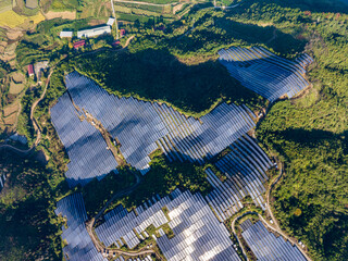 Aerial photography of solar photovoltaic panels on the mountain