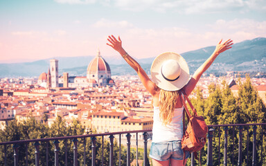 Wall Mural - happy woman tourist enjoys panoramic view of florence cityscape- italy