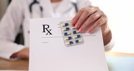 Wall Mural - Doctor giving form with prescription and blister of capsules in clinic closeup 4k movie slow motion. Prescription of pharmaceuticals concept