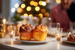 Bowl with tasty Traditional Yorkshire Pudding on table in room decorated for Christmas