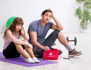 Wall Mural - Young woman feeling bad during training in first aid concept