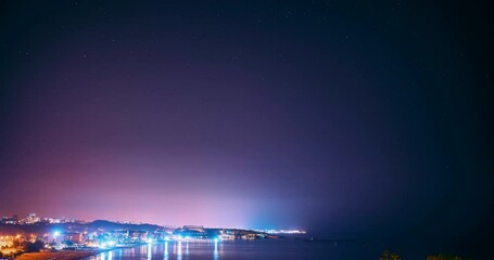 Wall Mural - Amazing Night Sky With Star Trails. Hyperlapse Turkish Riviera Or Turquoise Coast. Timelapse Stars and aircraft Traces In Night Starry Sky Above Mediterranean Coast Of Antalya And Alanya. Travel To