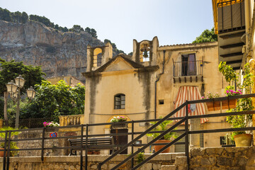 Wall Mural - Historic building in street of Cefalu town, an attractive destination in Sicily, Italy, Europe.