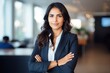 © id512 - successful confident arabian hispanic smiling latino indian businesswoman worker lady boss female leader business woman posing hands crossed looking at camera in office corporate portrait