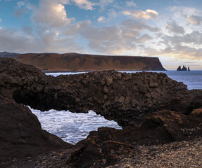 Canvas Print - Picturesque autumn evening view to Reynisfjara ocean  black volcanic sand beach and rock formations from Dyrholaey Cape, Vik, South Iceland. Mount Reynisfjall on the background.