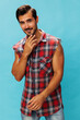 © SHOTPRIME STUDIO - Man happy guy friendly background arm plaid smile trendy attractive shirt confident blue