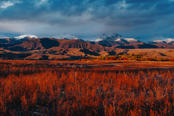 Canvas Print - Picturesque autumn landscape with mountains at red sunset light