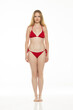 © vladimirfloyd - Full body, front view young blond woman in bikini posing on white background