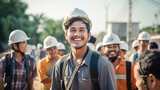 Fototapeta  - A group of happy asian workers laughing on building site. 
