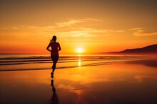 A Woman Running Exercise On The Beach At Sunrise