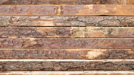 Poster -  stack of raw boards as sawmill products, wooden natural texture background