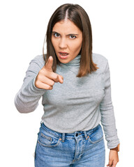 Canvas Print - Young beautiful woman wearing casual turtleneck sweater pointing displeased and frustrated to the camera, angry and furious with you