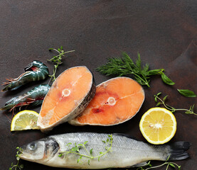 Wall Mural - raw fish sea bass and salmon with lemon and herbs