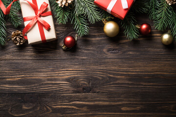 Wall Mural - Christmas presents and holiday decorations on wooden background. Flat lay image.