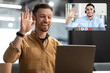 © Prostock-studio - Man Waving Hello To Laptop Making Video Call In Office