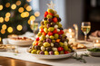 Antipasto Christmas Tree festive appetizer. Horizontal, close-up, side view.