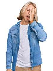 Sticker - Caucasian man with blond long hair wearing casual denim jacket yawning tired covering half face, eye and mouth with hand. face hurts in pain.