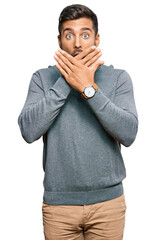 Poster - Handsome hispanic man wearing casual clothes shocked covering mouth with hands for mistake. secret concept.