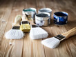 © Kedek Creative - Paintbrush with colorful paint on a wooden floor, ready to paint a work of art