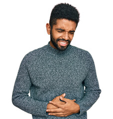 Wall Mural - Young african american man wearing casual clothes with hand on stomach because indigestion, painful illness feeling unwell. ache concept.