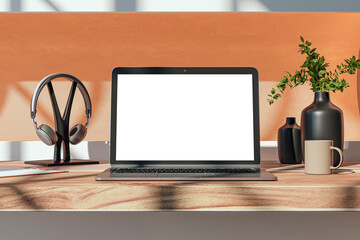 Poster - Close up of modern wooden designer desktop with empty white mock up place on laptop screen, coffee cup, supplies and other items. 3D Rendering.