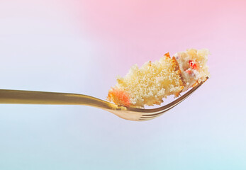 A Delicious Bite of White Cake on a Gold Fork