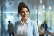 © vefimov - Professional woman in business suit holding tablet computer. Perfect for business and technology concepts.
