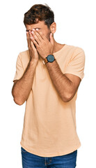 Sticker - Handsome young man with beard wearing casual tshirt rubbing eyes for fatigue and headache, sleepy and tired expression. vision problem