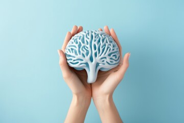 Poster - A person holding a brain model in their hands. Perfect for educational or medical-related projects