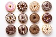 Set of 12 different colorful donuts isolated on white background. In glaze, with chocolate, with sprinkles, toppingt. View from above.