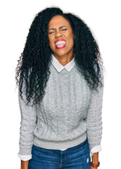 Sticker - Middle age african american woman wearing casual clothes sticking tongue out happy with funny expression. emotion concept.