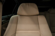 Passenger leather car seat. Luxury car interior detail.