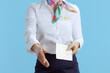 © Alliance - Modern air hostess woman on blue giving hand for handshake