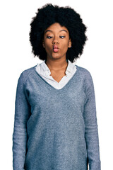 Poster - Young african american woman wearing business clothes making fish face with lips, crazy and comical gesture. funny expression.