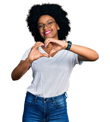 Sticker - Young african american woman wearing casual white t shirt smiling in love doing heart symbol shape with hands. romantic concept.