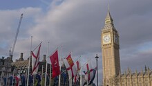 The Flags Of Parliament Square Garden And Big Ben In The Background On A Spring Evening In London, England