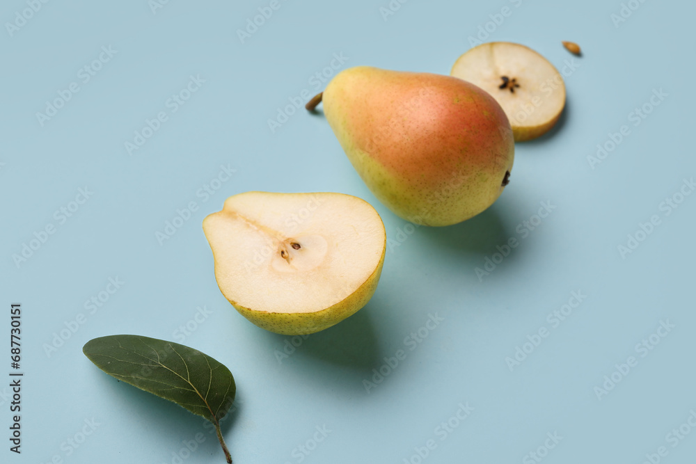 Ripe pears on blue background