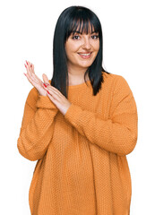 Poster - Young hispanic woman wearing casual clothes clapping and applauding happy and joyful, smiling proud hands together