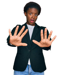 Wall Mural - Young african american girl wearing business clothes doing stop gesture with hands palms, angry and frustration expression