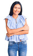 © Krakenimages.com - Young beautiful latin girl wearing casual clothes happy face smiling with crossed arms looking at the camera. positive person.