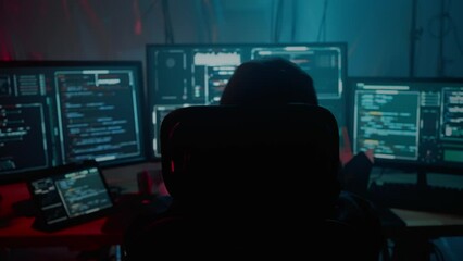 Male stretching fingers and neck during cyber attack on pc