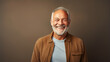 © Tierney - Happy senior man in his 70s on a solid background