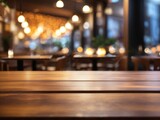 Fototapeta Sport - Wooden top table with bokeh light effect and blur restaurant on background