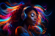 Young African woman listening to music with headphones on colourful abstract background.
