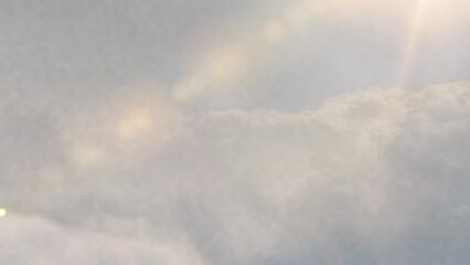 Wall Mural - cinematic breathtaking aerial flying backwards through the white fluffy clouds high in the heavenly 