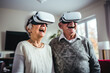 Joyful Senior Couple Experiencing Virtual Reality Together
