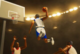 Fototapeta Sport - 3d illustration two team of professional basketball player slam dunk in sport arena
